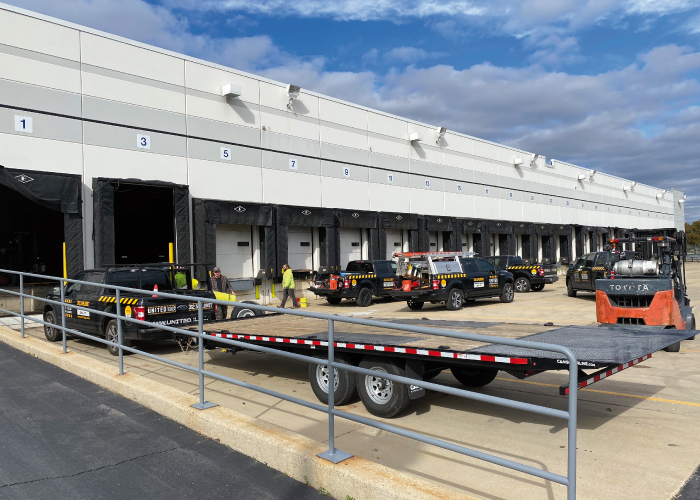 United Door and Dock Trucks Parked Outside Warehouse Docks