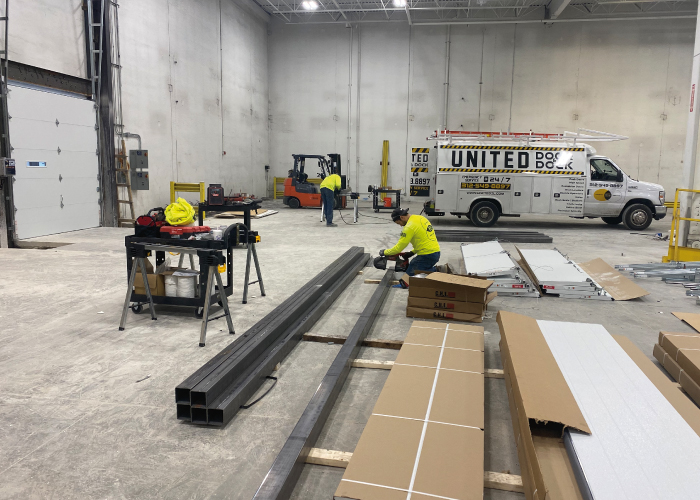 United Door and Dock Crew Member Working on Project inside of warehouse