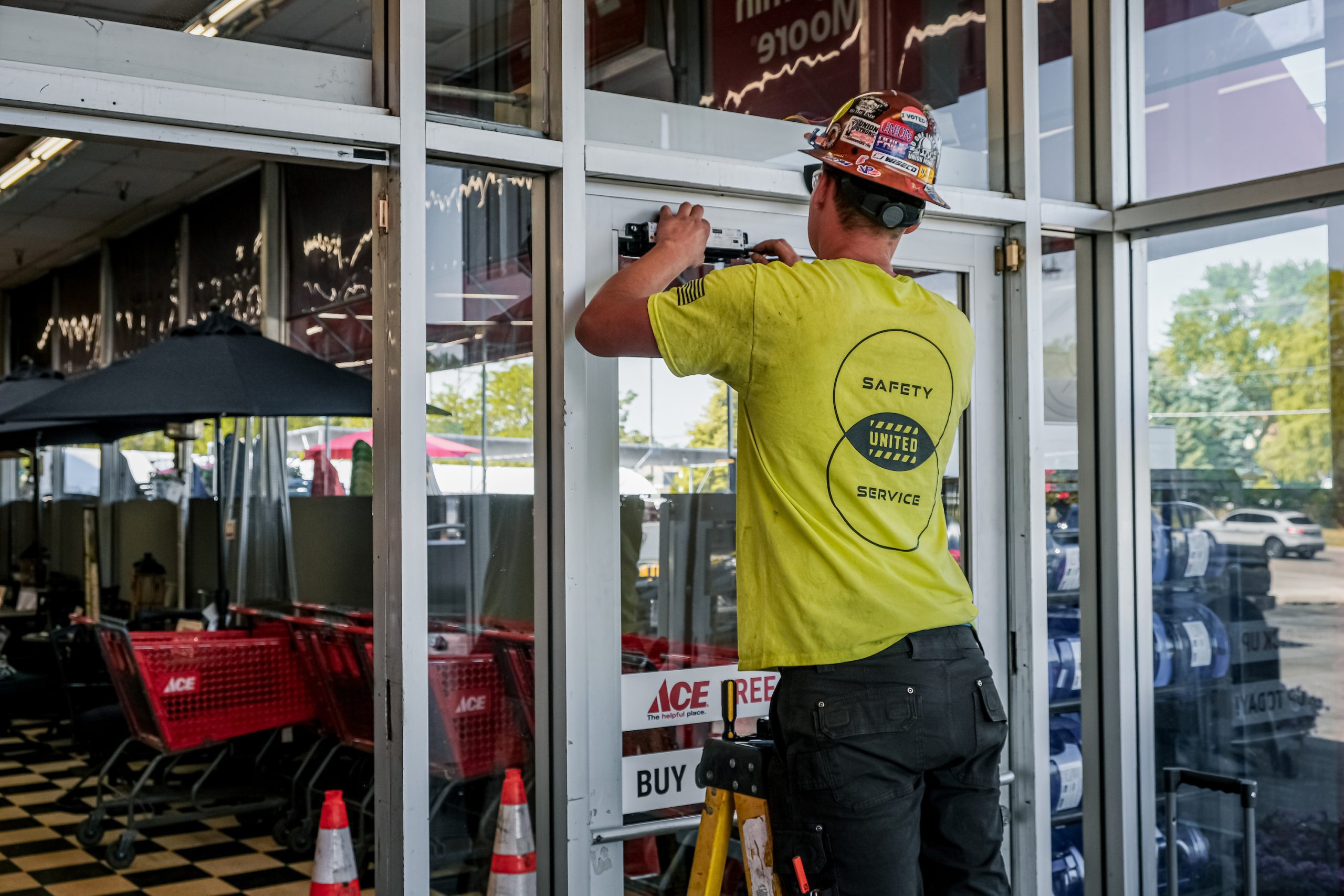 United Door and Dock Crew Member Working on Entrance Door