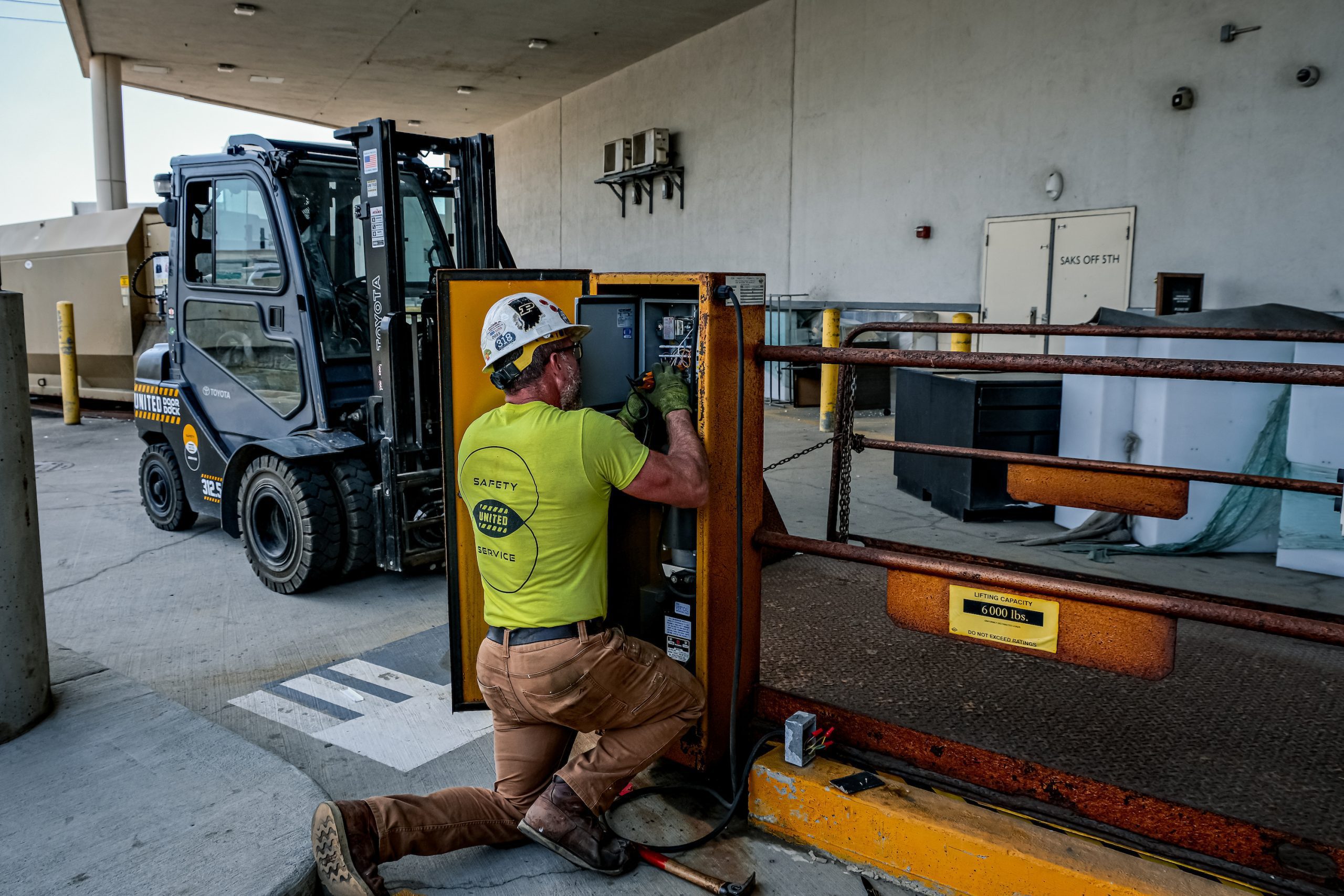 United Door and Dock Crew Member Working on Electric Operator