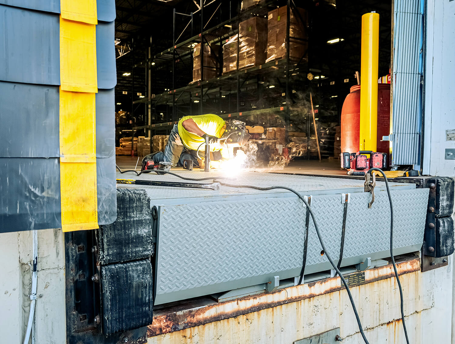 United Door and Dock Crew Member Working on Dock Leveler