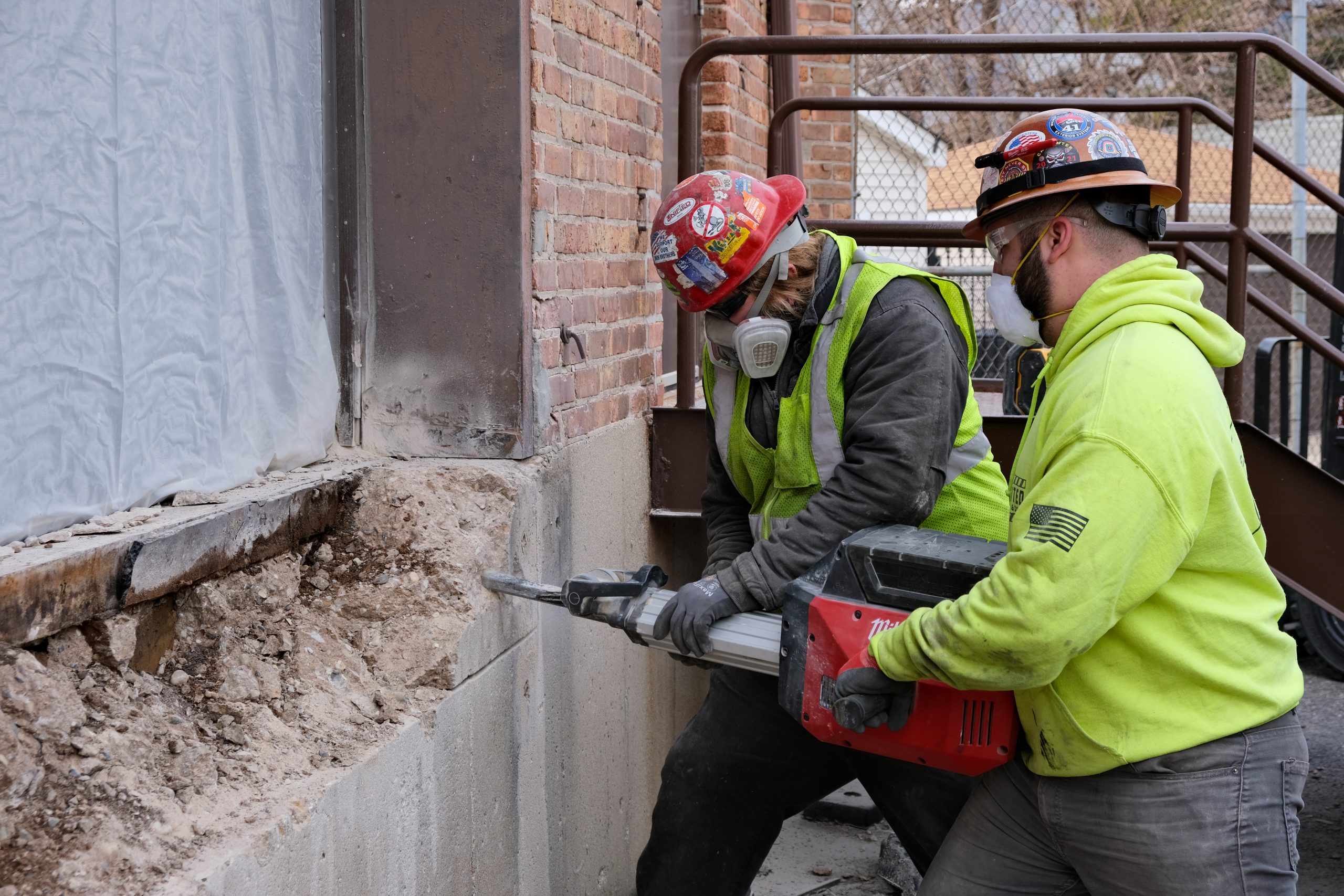 Technicians Working On Concrete For Edge Of Dock Leveler Installation